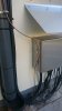Lightning protection box outside wall - grounding cable coming from roof.jpg